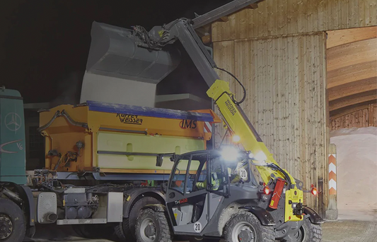 Telehandler loading salt lorry