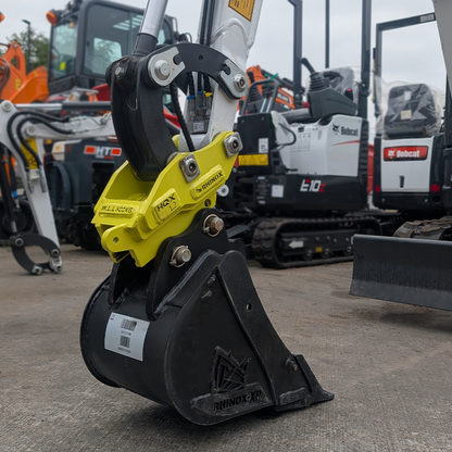 1.5T Fabricated Quick Hitch Lifestyle Image - mounted with a bucket