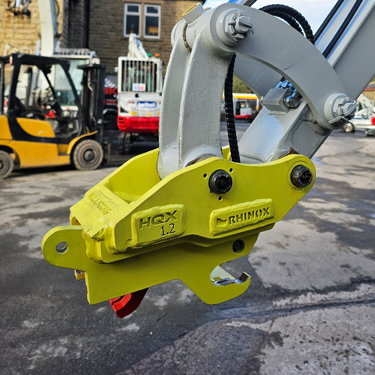 1.5T Fabricated Quick Hitch Lifestyle Image 2 - mounted on a digger arm